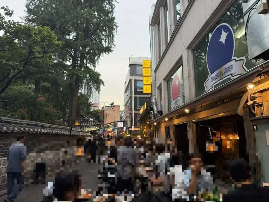 Outdoor seating facing the stone wall