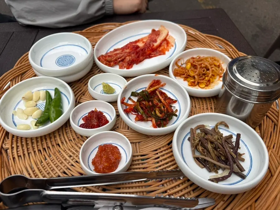 Basic side dishes including kimchi, bean sprouts, and bracken fern