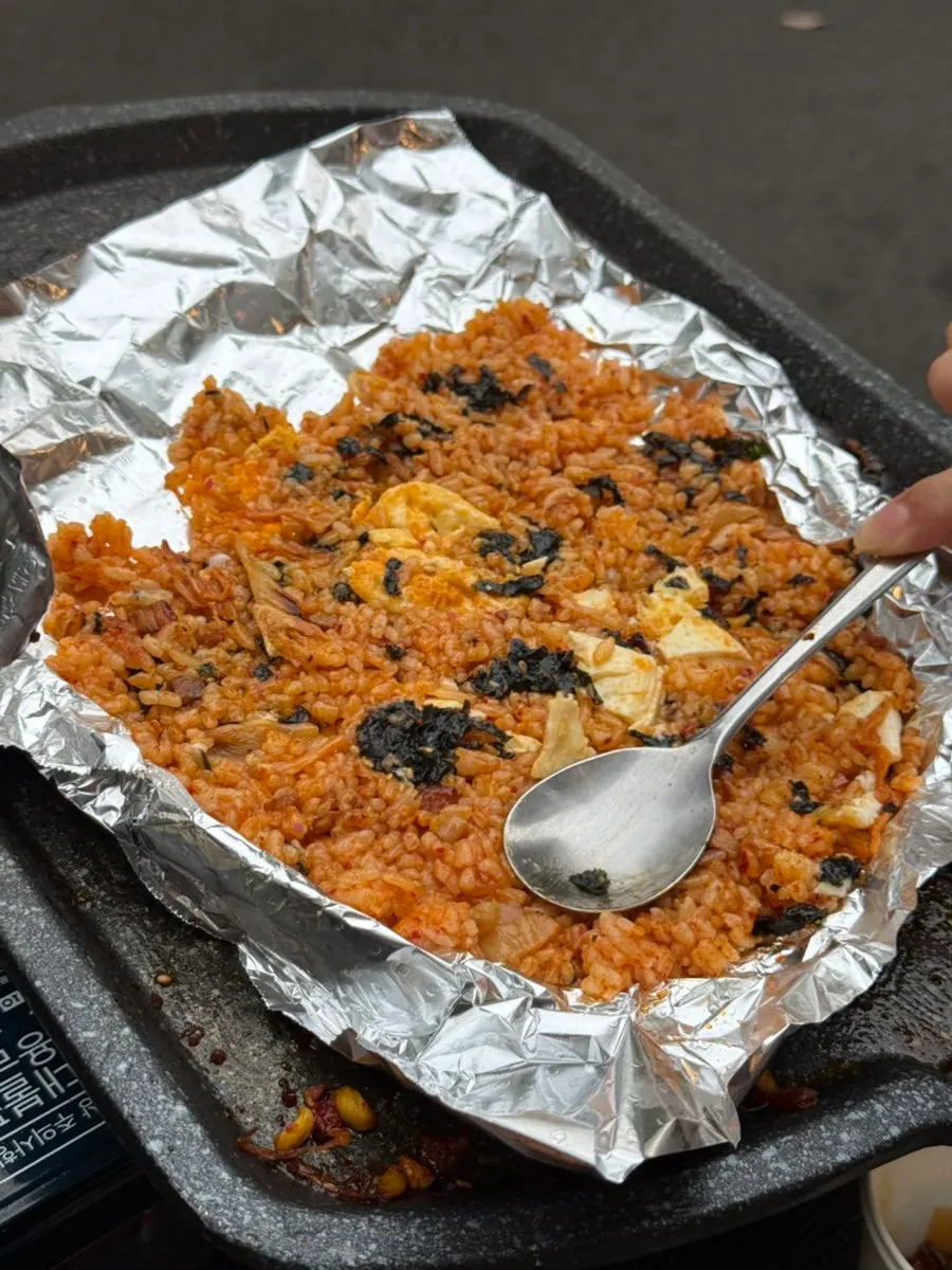 Kimchi fried rice spread and pressed on the grill