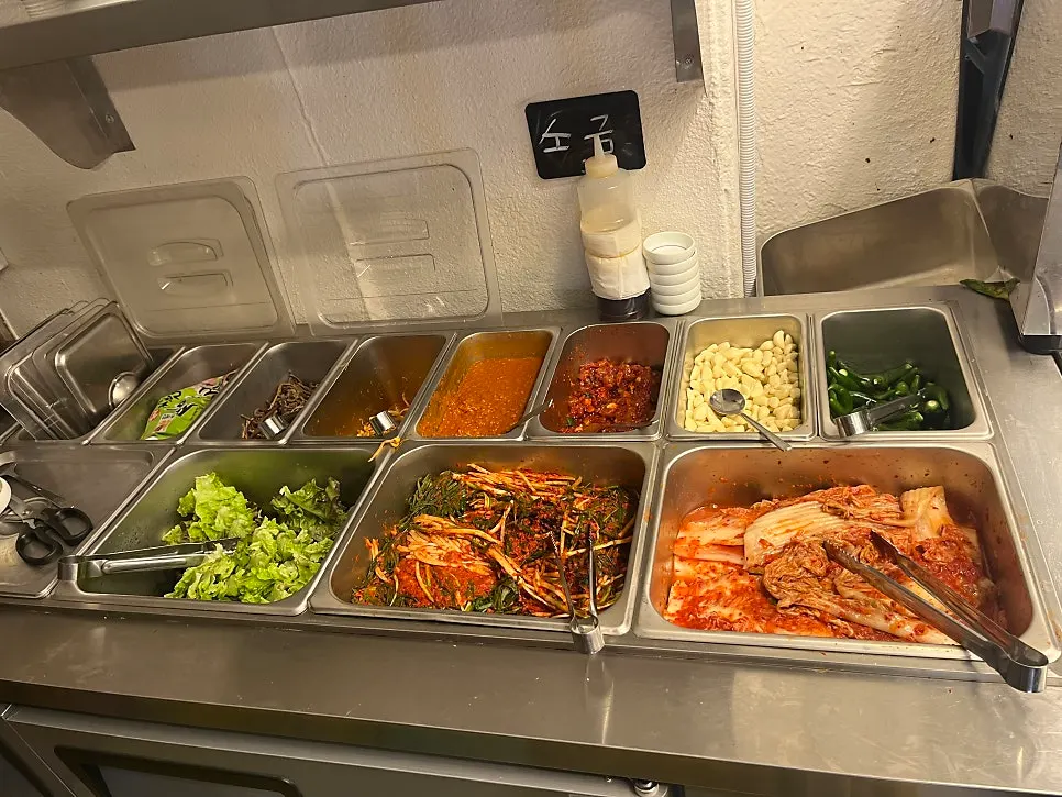 Self-bar for side dishes set up near the counter