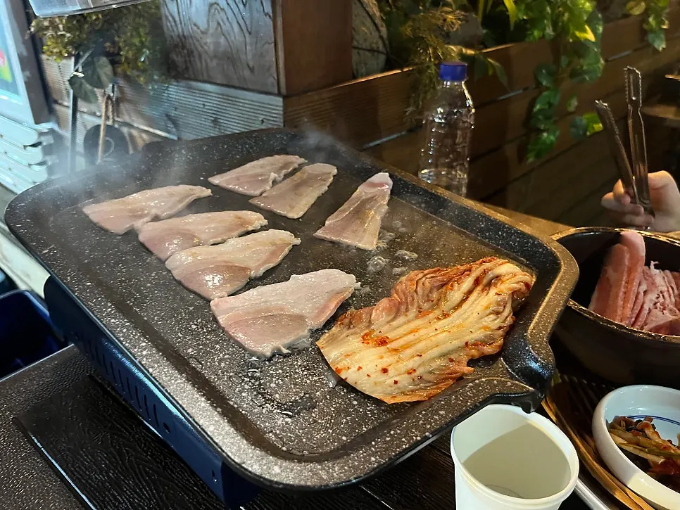 Grilled pork belly with a soju shot glass