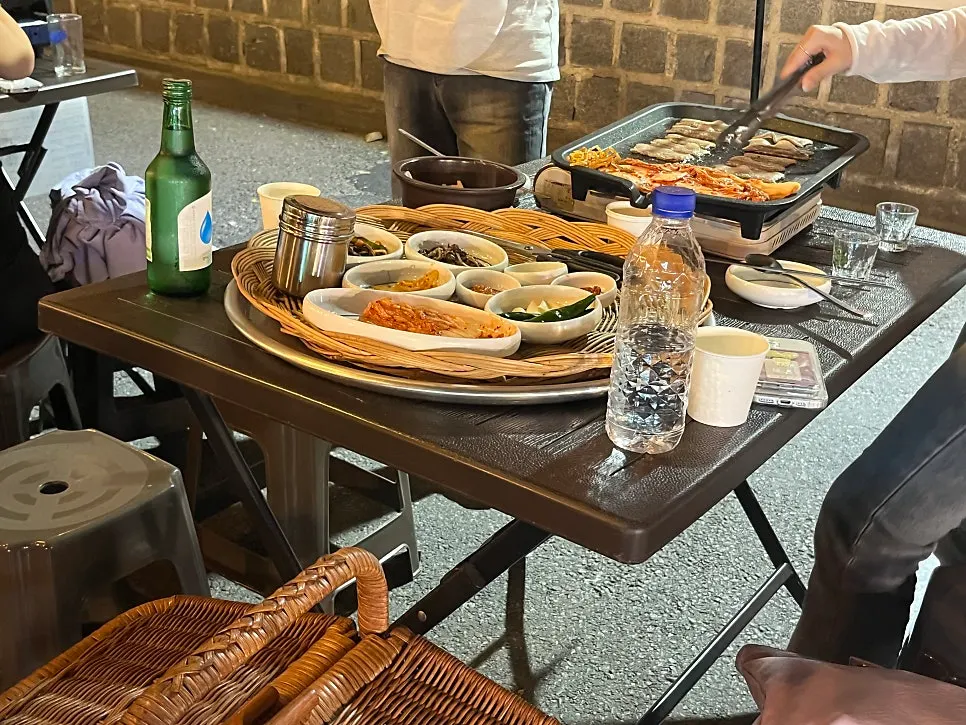 Table with refilled kimchi and grilled meat