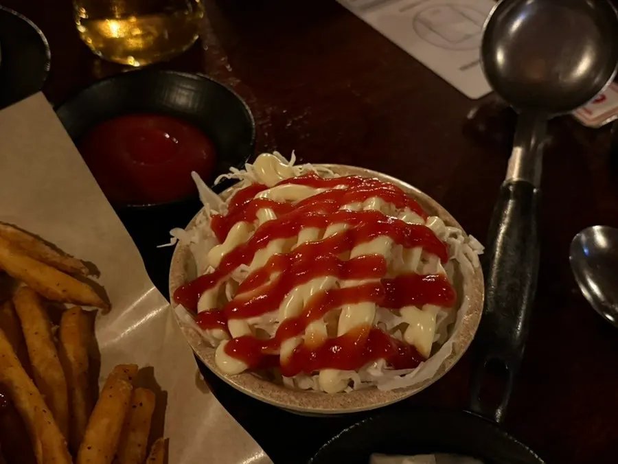 Slightly spicy chicken bites served with fries