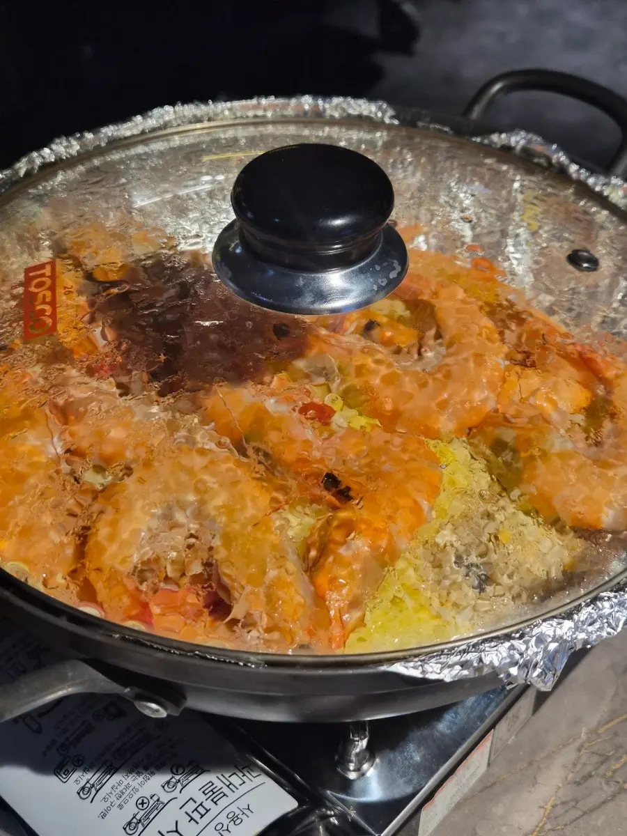 Salt-grilled shrimp cooking on the burner