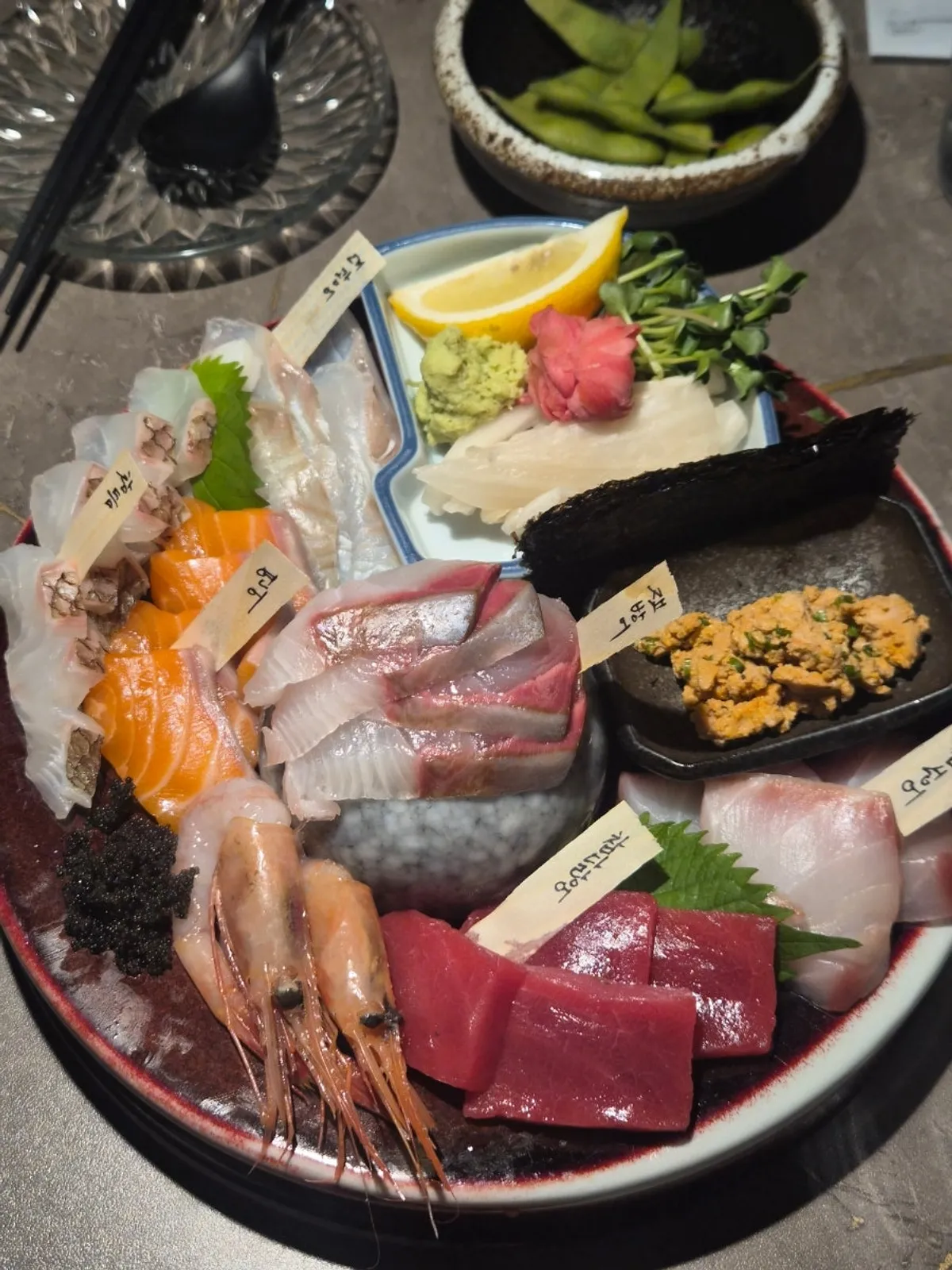 Aged sashimi set for two piled high in one bowl