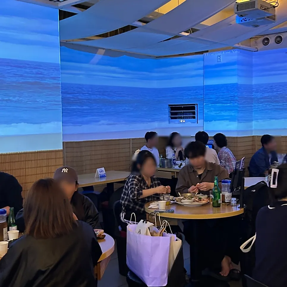 Restaurant interior with ocean-themed LED wall