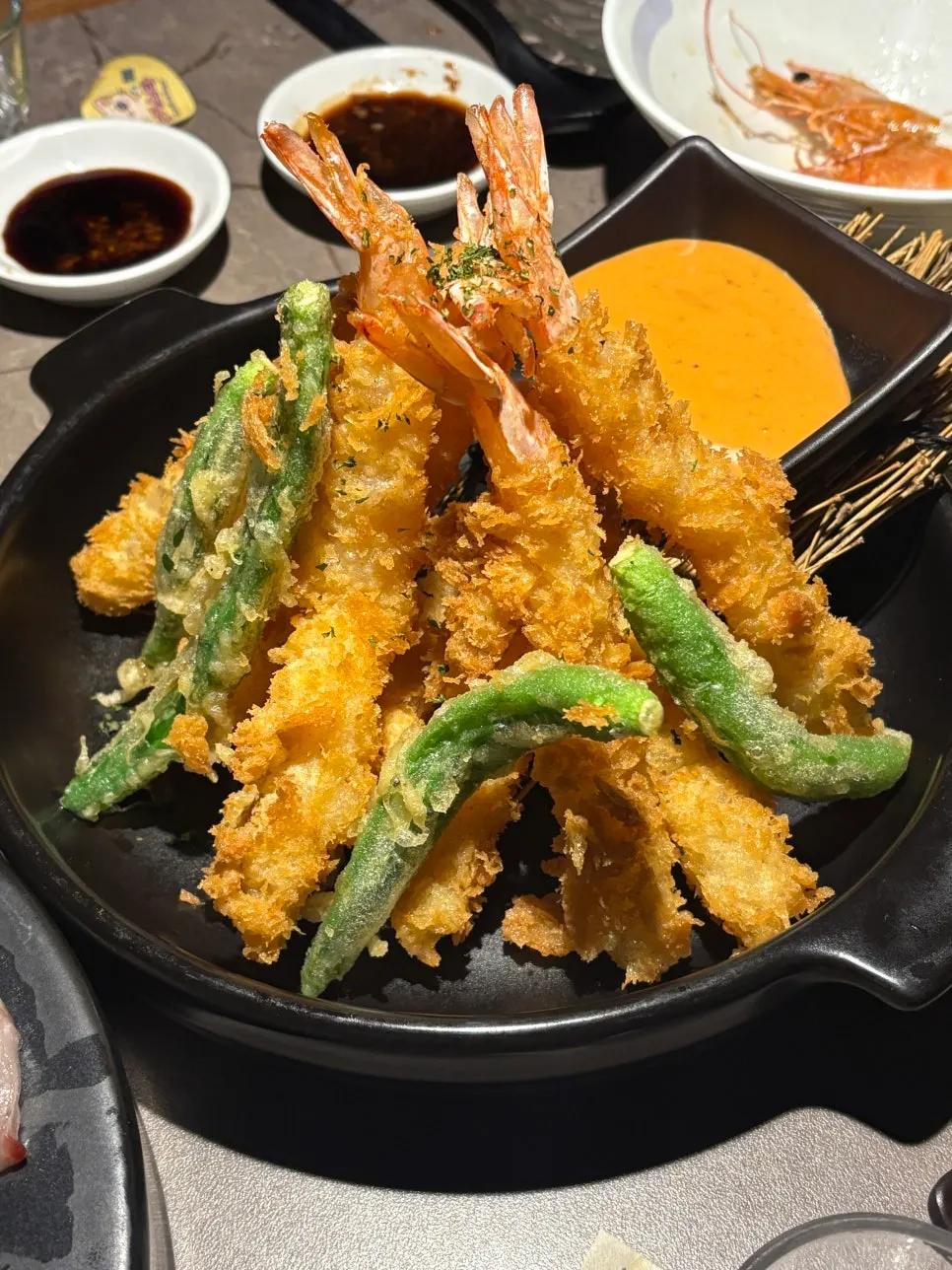 Picking up a butter-grilled shrimp head
