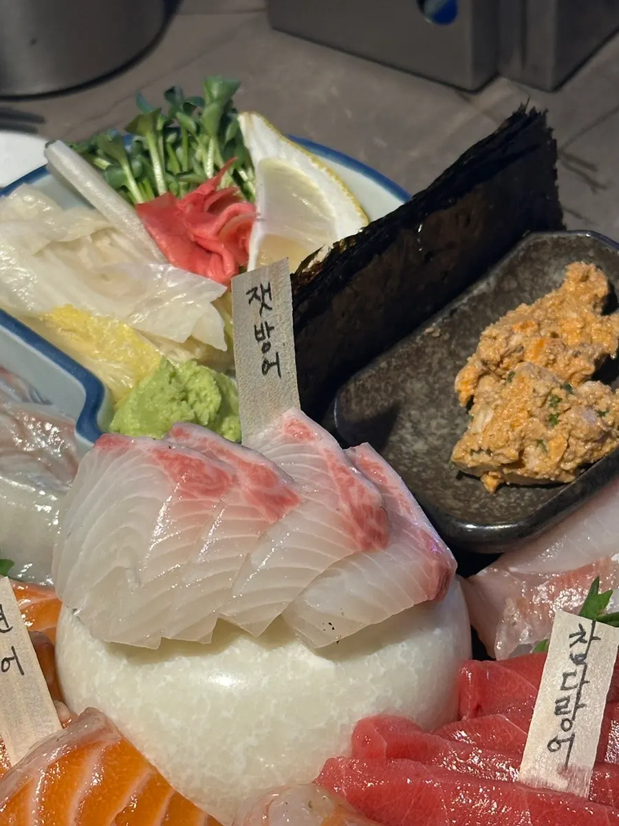 Aged sashimi platter with each fish type labeled