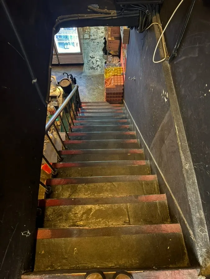 Entrance to the steep stairs down to the basement level