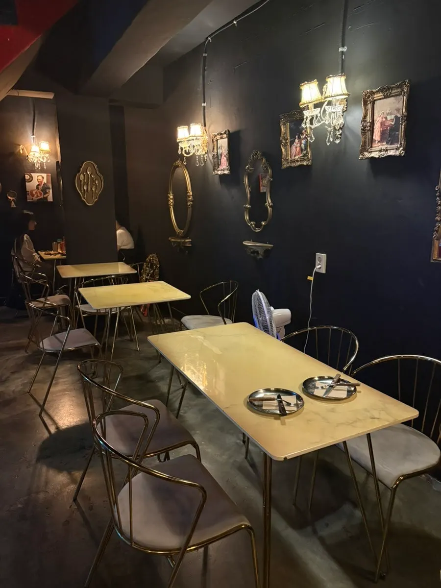 Dimly lit interior of the basement pizza restaurant
