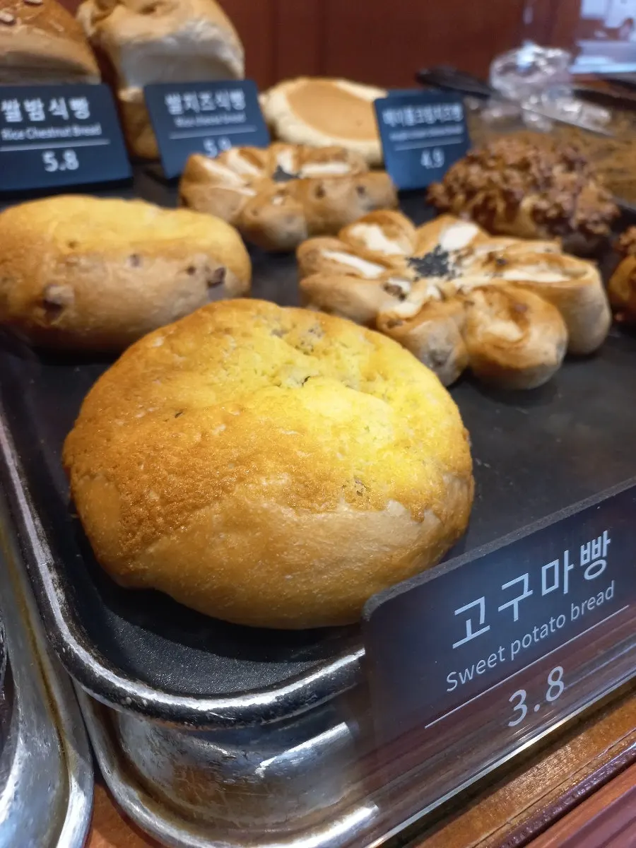 Munhwa Bakery display with a cheese bread sample