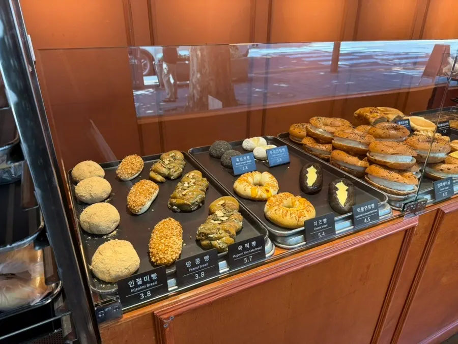 Various breads displayed on Munhwa Bakery's shelves
