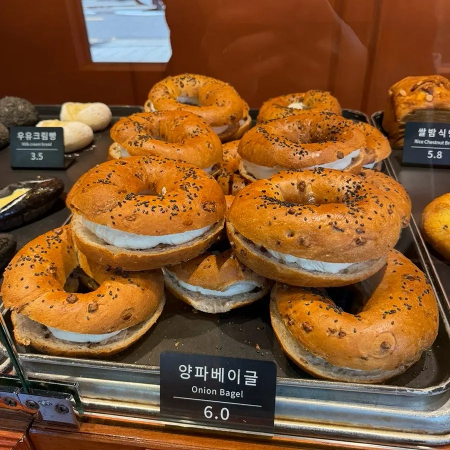 Sweet potato bread and black sesame bread on display at Munhwa Bakery