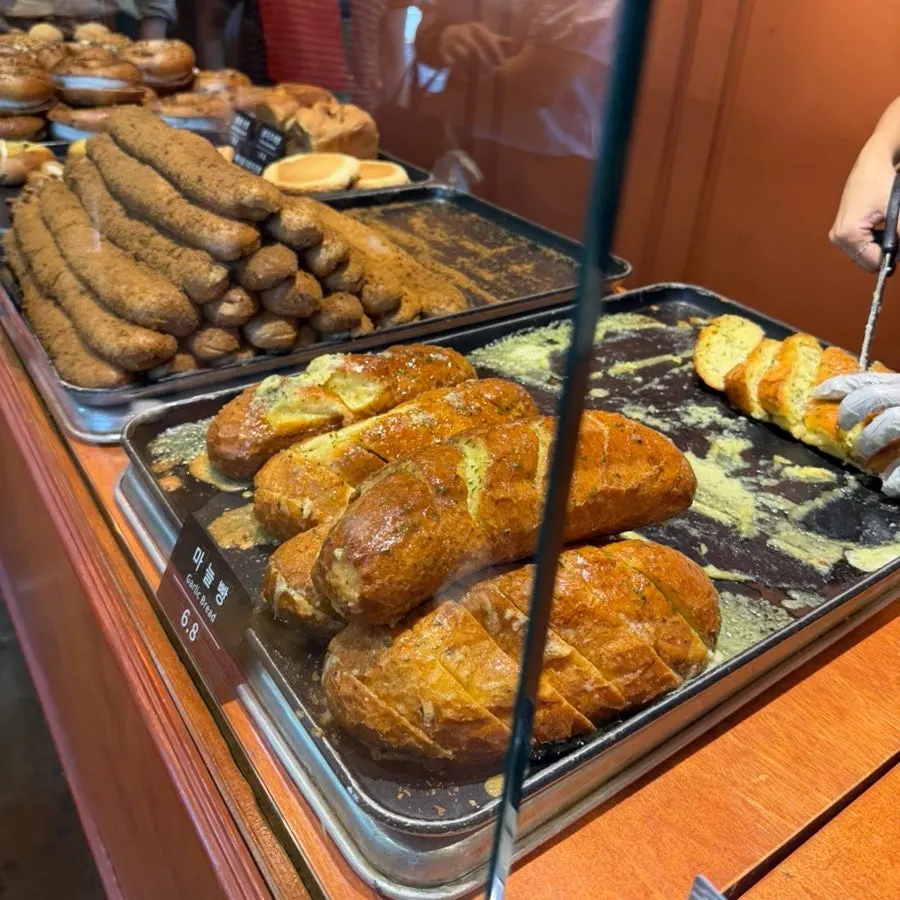 Sweet cream breads displayed inside Munhwa Bakery
