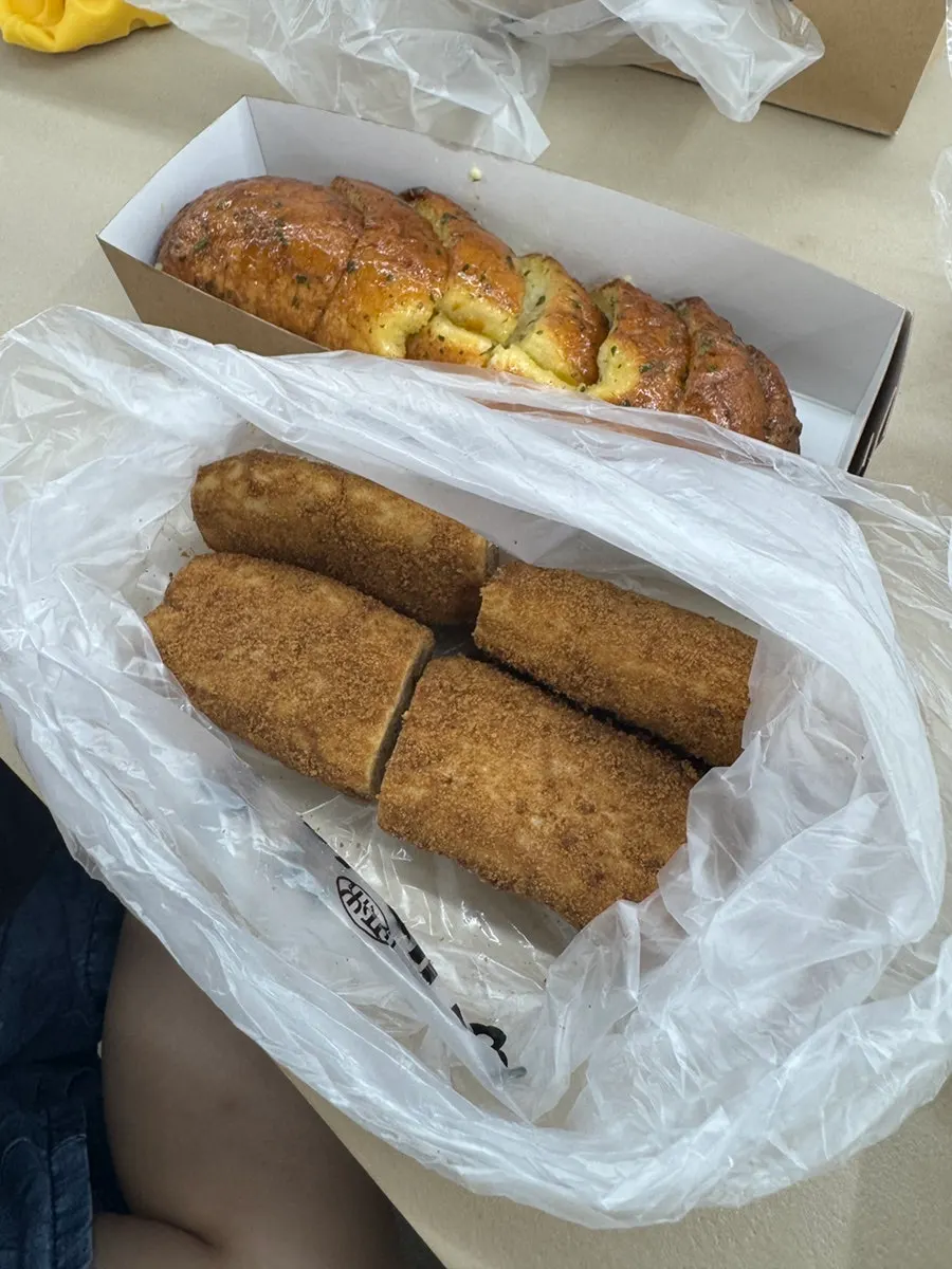 Appetizing garlic bread and coffee buns