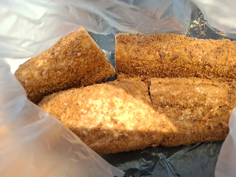 Coffee bread with castella crumbs, bitten into