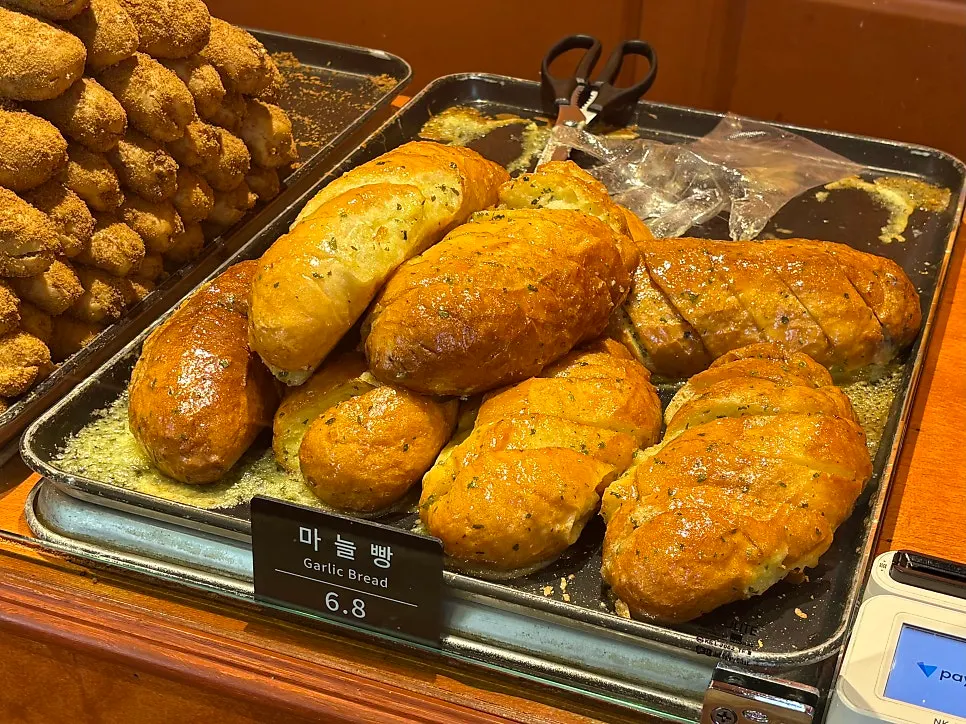Breads displayed inside Munhwa Bakery