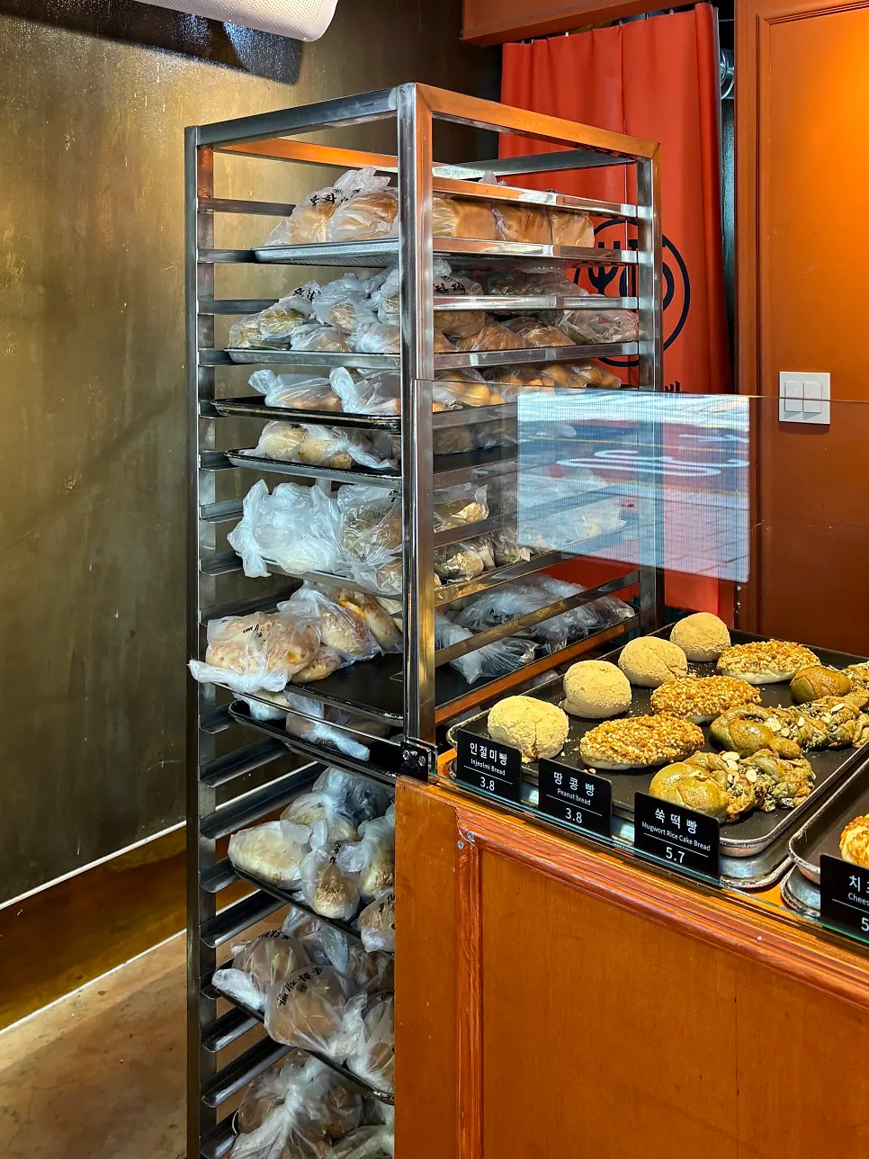 Display of various breads including injeolmi bread and mugwort rice cake bread