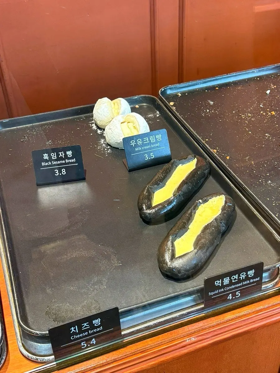 Black sesame, milk cream, and squid-ink condensed milk breads
