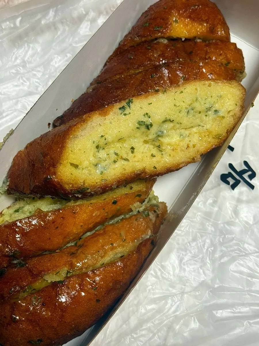 Packed garlic, white bean paste, and squid-ink condensed milk breads