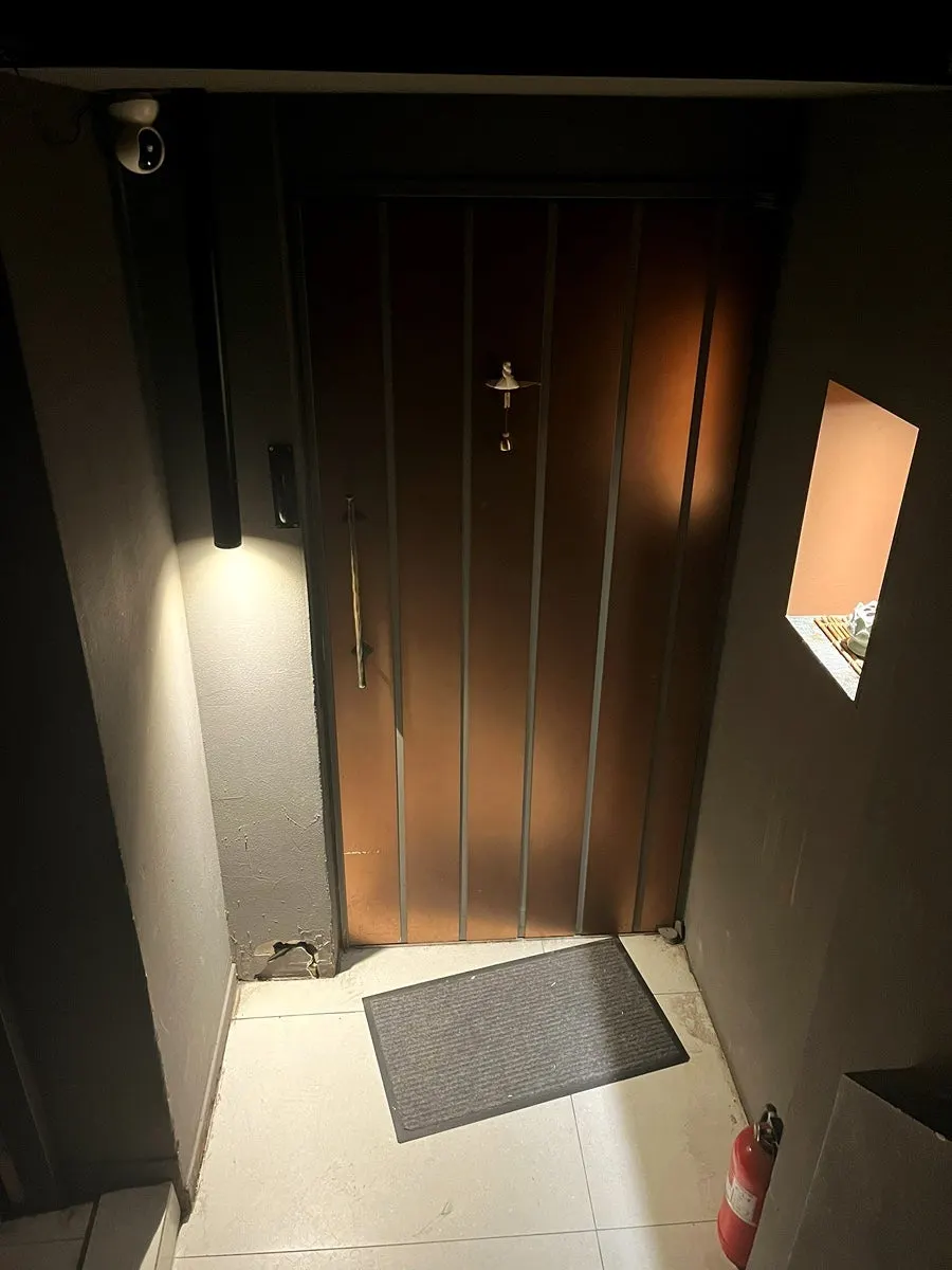 Basement stairs leading down to Hanuk