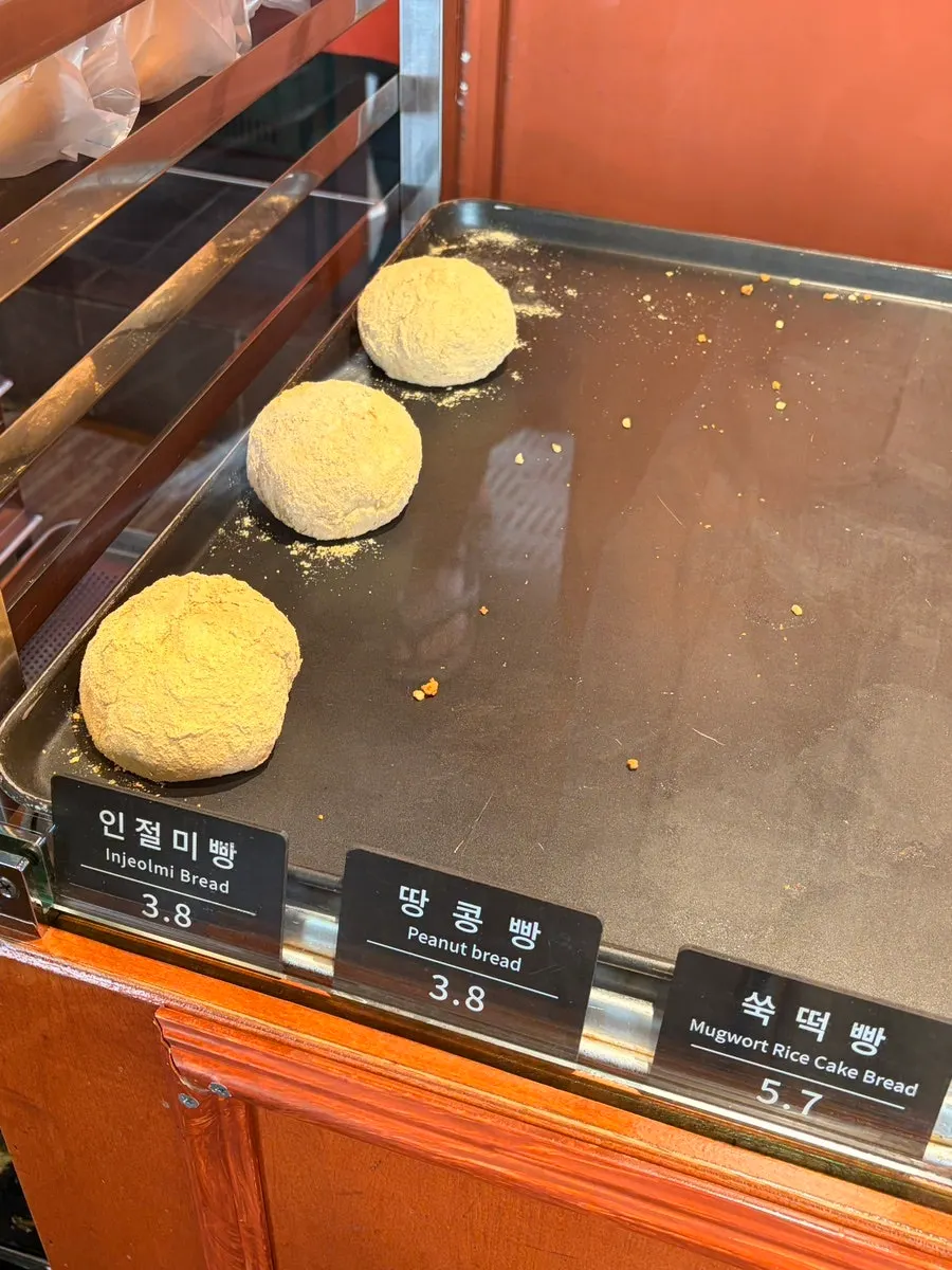 Cheese bread and squid ink condensed-milk bread on display
