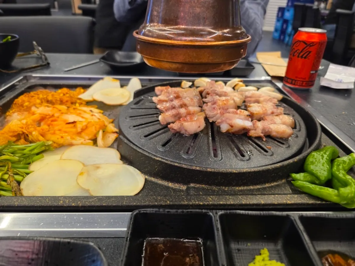 Table setting with Jirisan black pork five-layer pork belly at Cham Dwaejitgan Jongno Main Branch