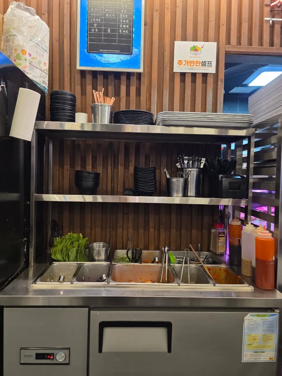 Self-serve vegetable sides and whole-leaf kimchi station