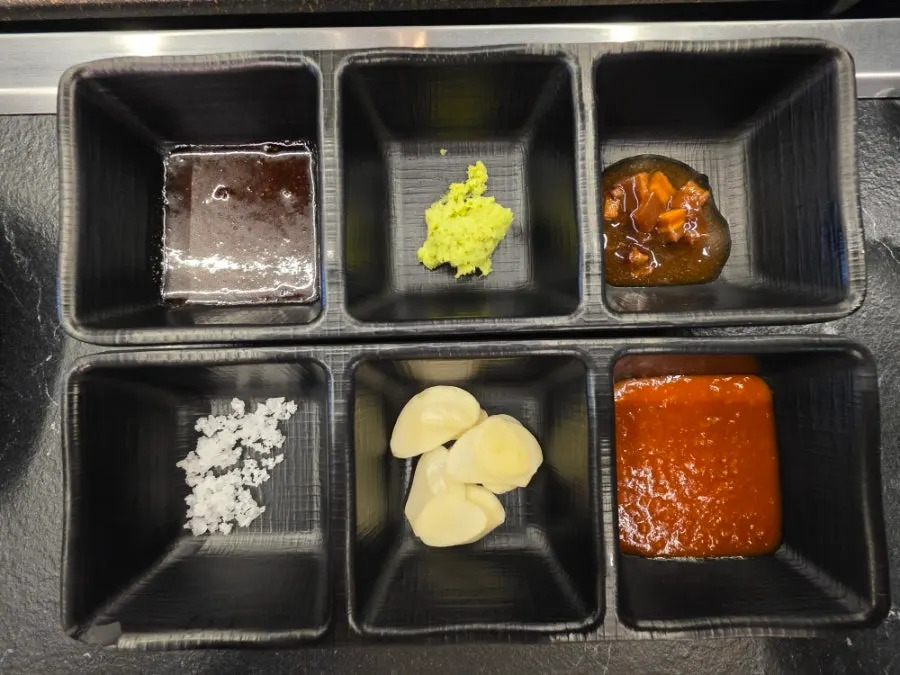 Plate of six individual sauces