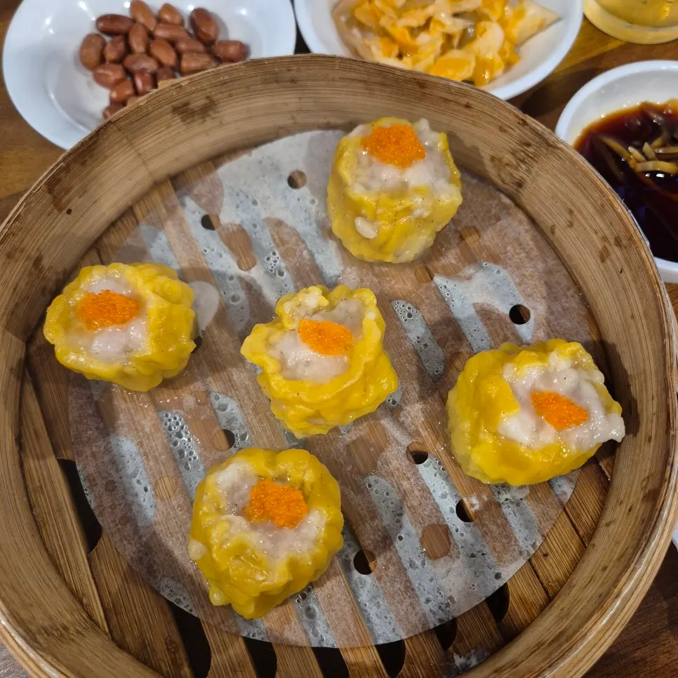 Shumai dim sum topped with flying-fish roe