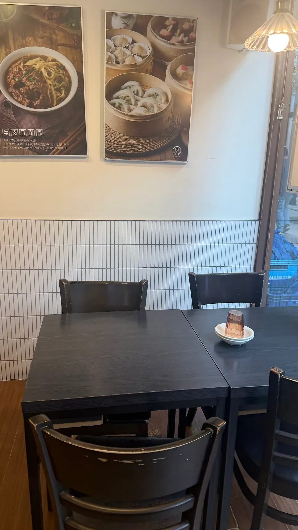Cheonghwa Uyuk Dosakmyeon menu board showing dim sum and dish-style dishes