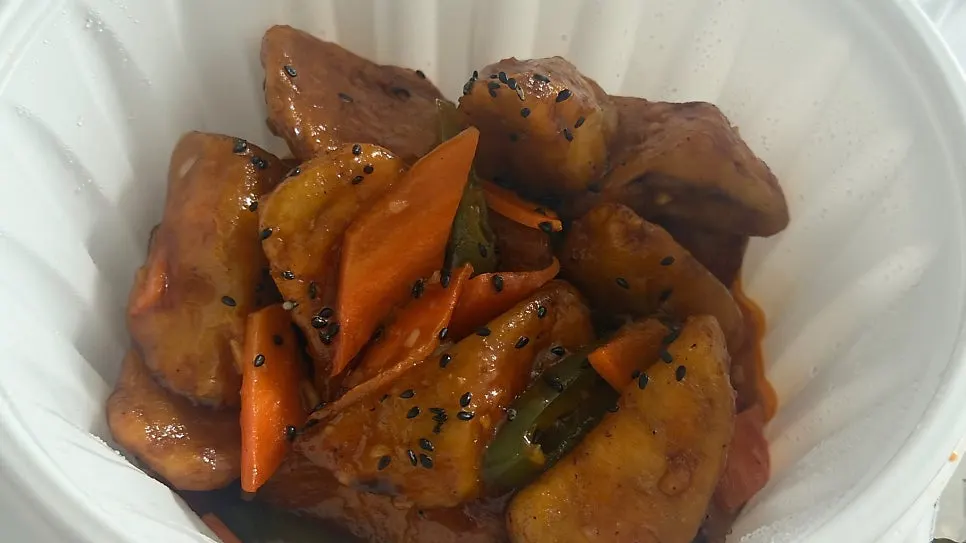 Takeout container of Cheonghwa Uyuk Dosakmyeon's yuxiang eggplant fry
