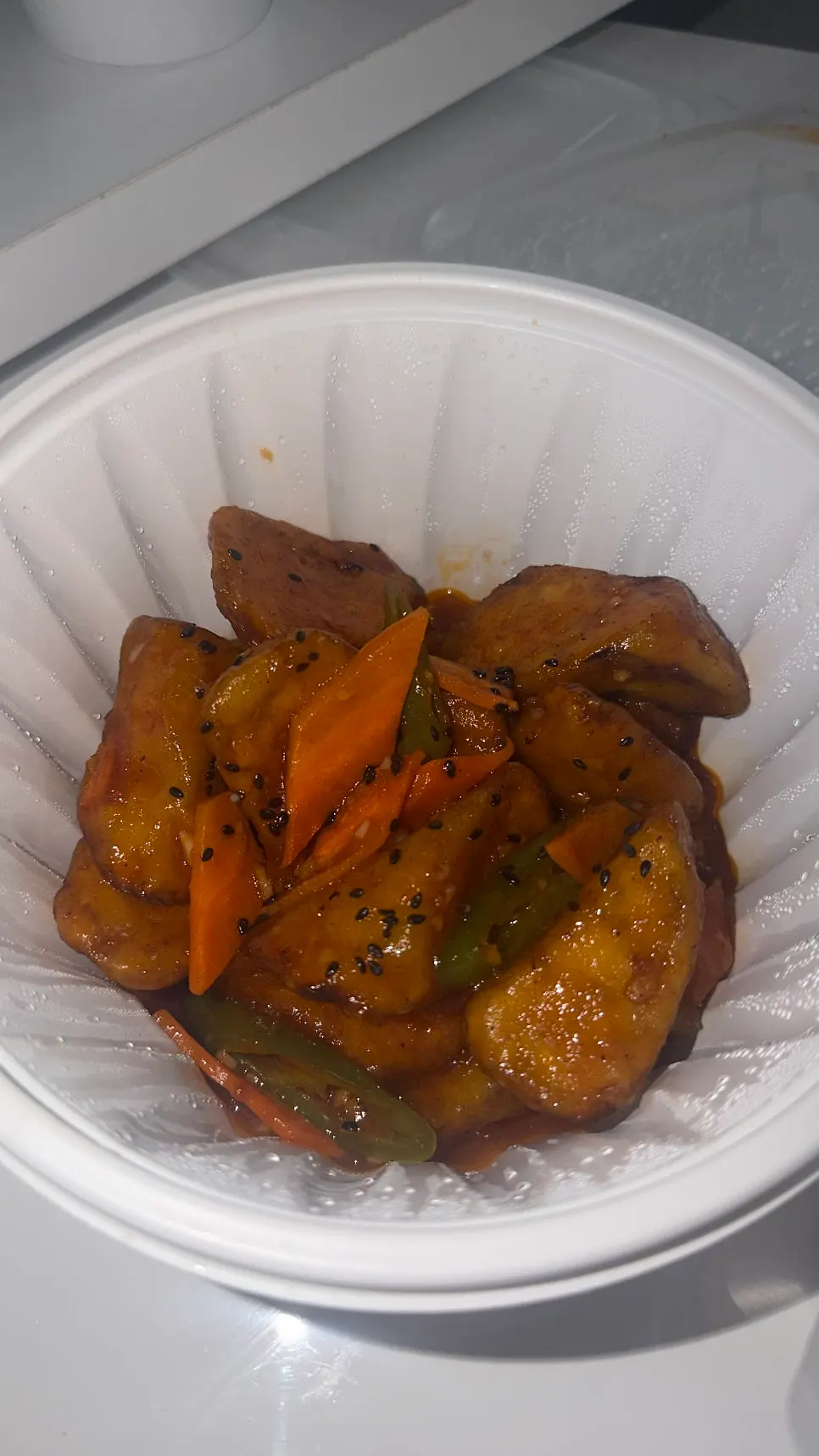 Generously portioned eggplant fry takeout container
