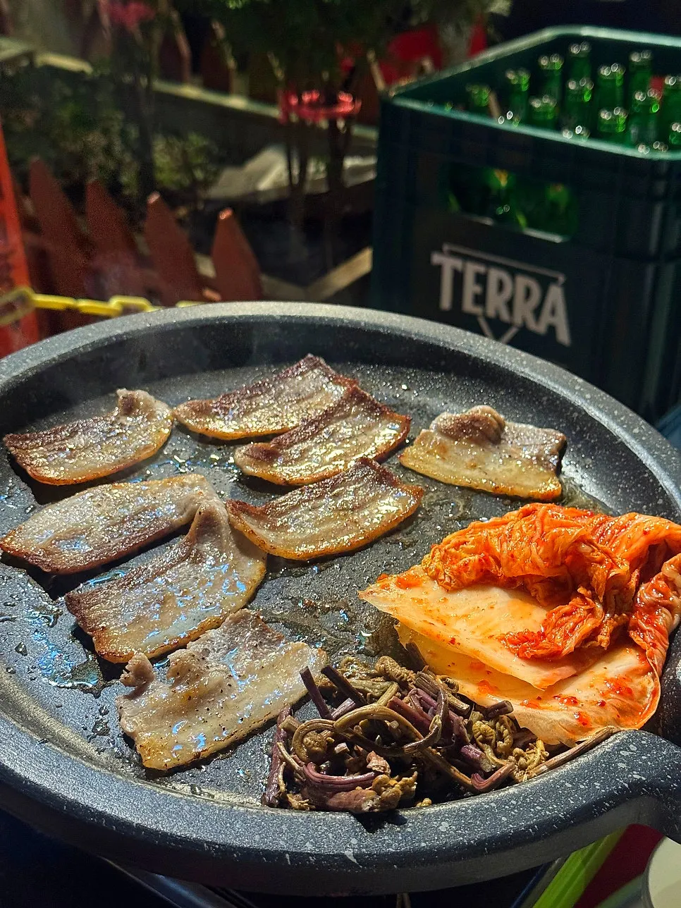 Outdoor tent table set with meat and beef brisket doenjang jjigae