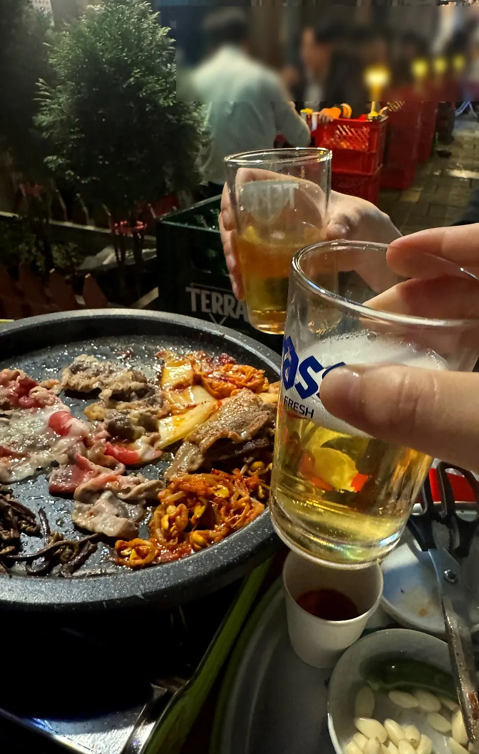 Soju-beer and a piece of pork belly at the outdoor tent