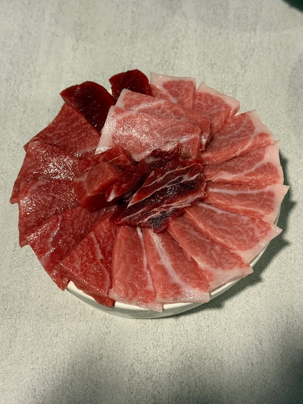 A glossy assorted platter of Jongno Darang's bluefin tuna