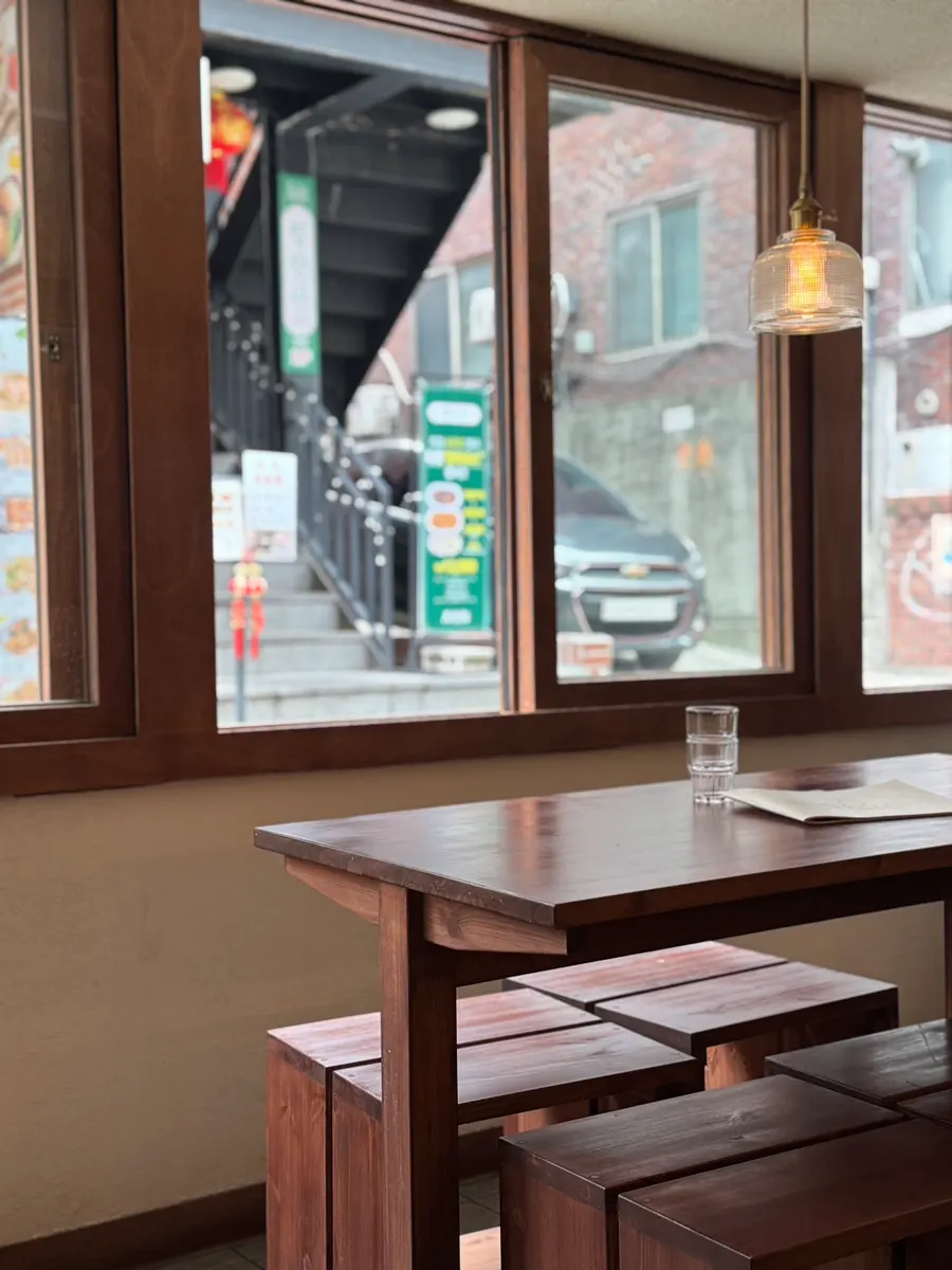 Seating with two-top tables and bar counter seats