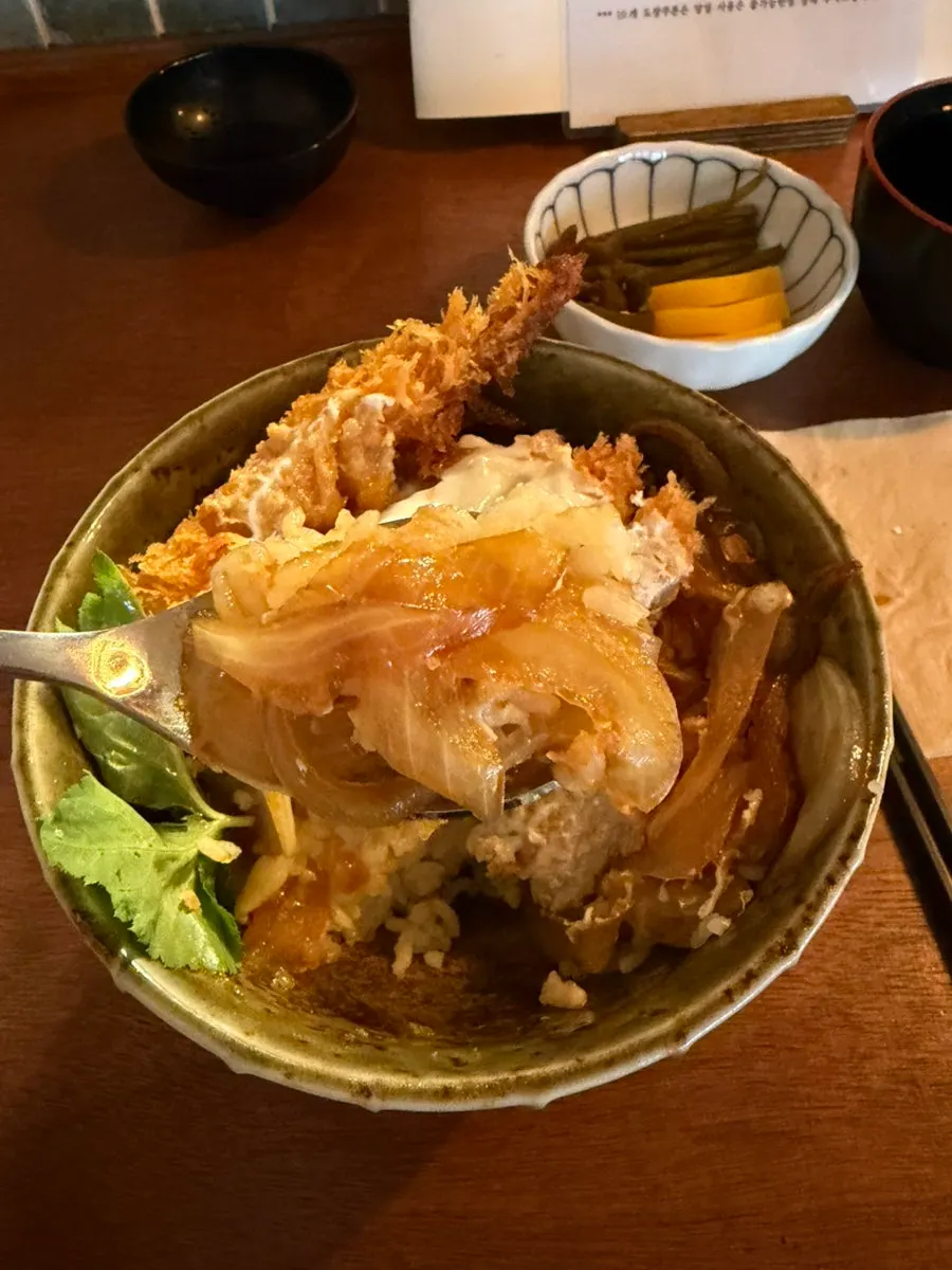 Close-up of mix katsu-don topped with thick shrimp tempura
