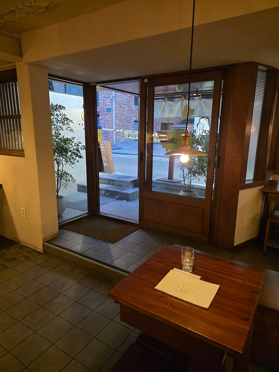 Interior with wood tables and warm lighting