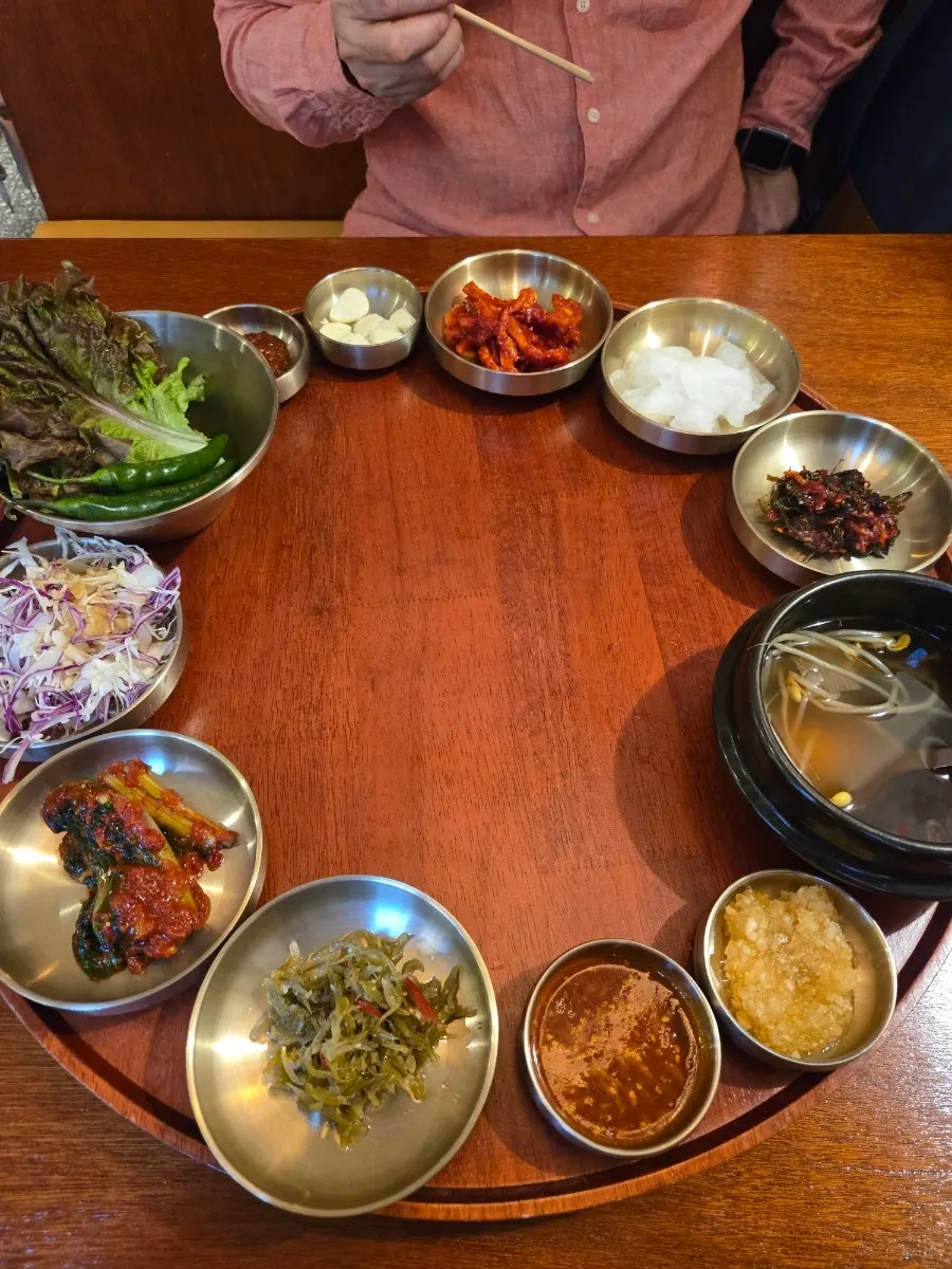 Banchan served in brassware as part of the jokbal set