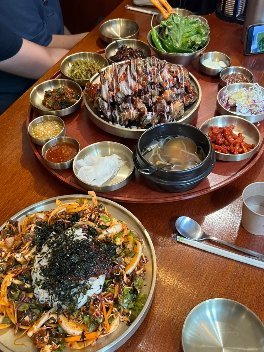 Side dishes including ssamjang, mustard leaf kimchi, and bossam kimchi