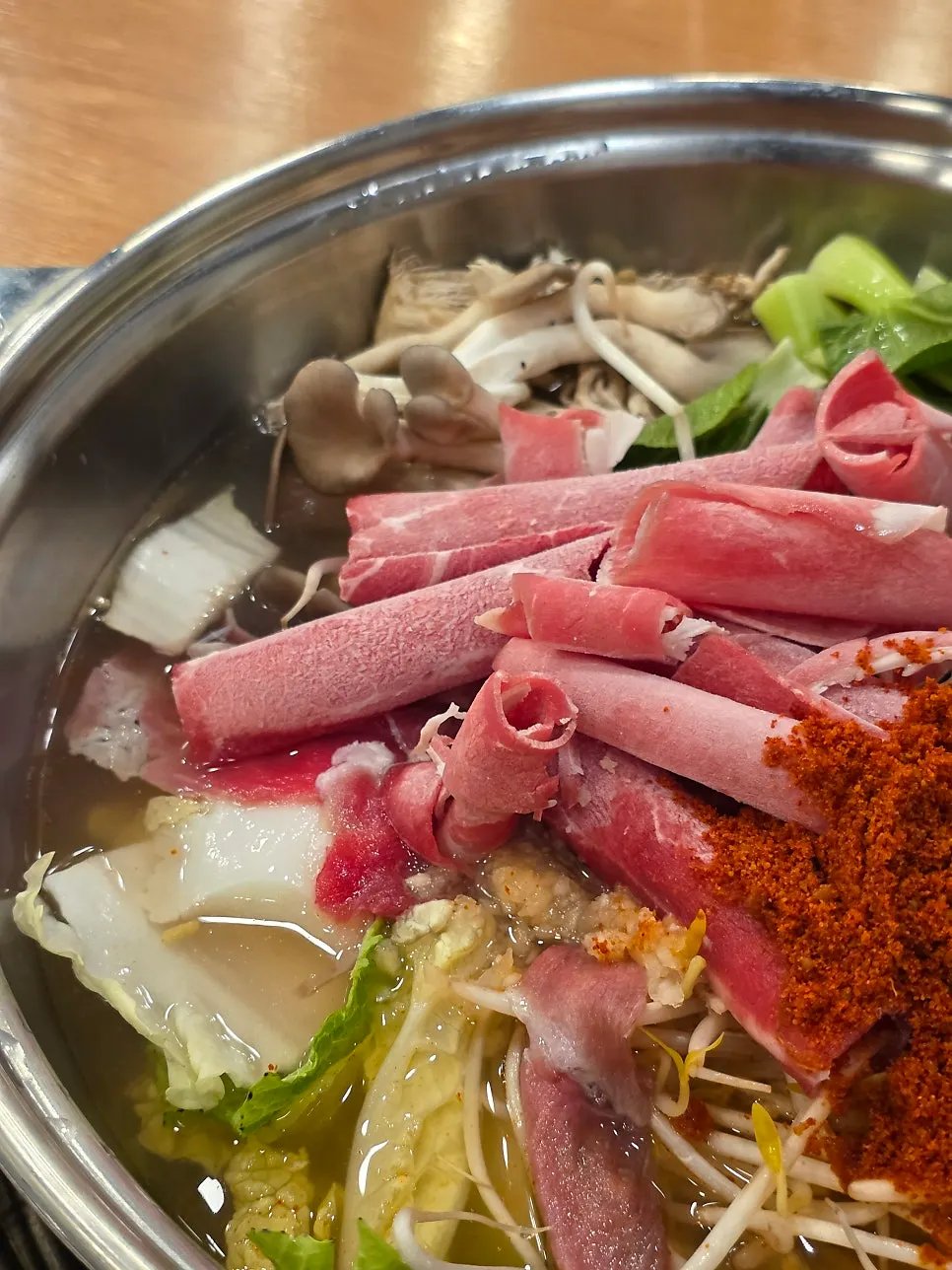 Hot pot with beef, napa cabbage, and bean sprouts