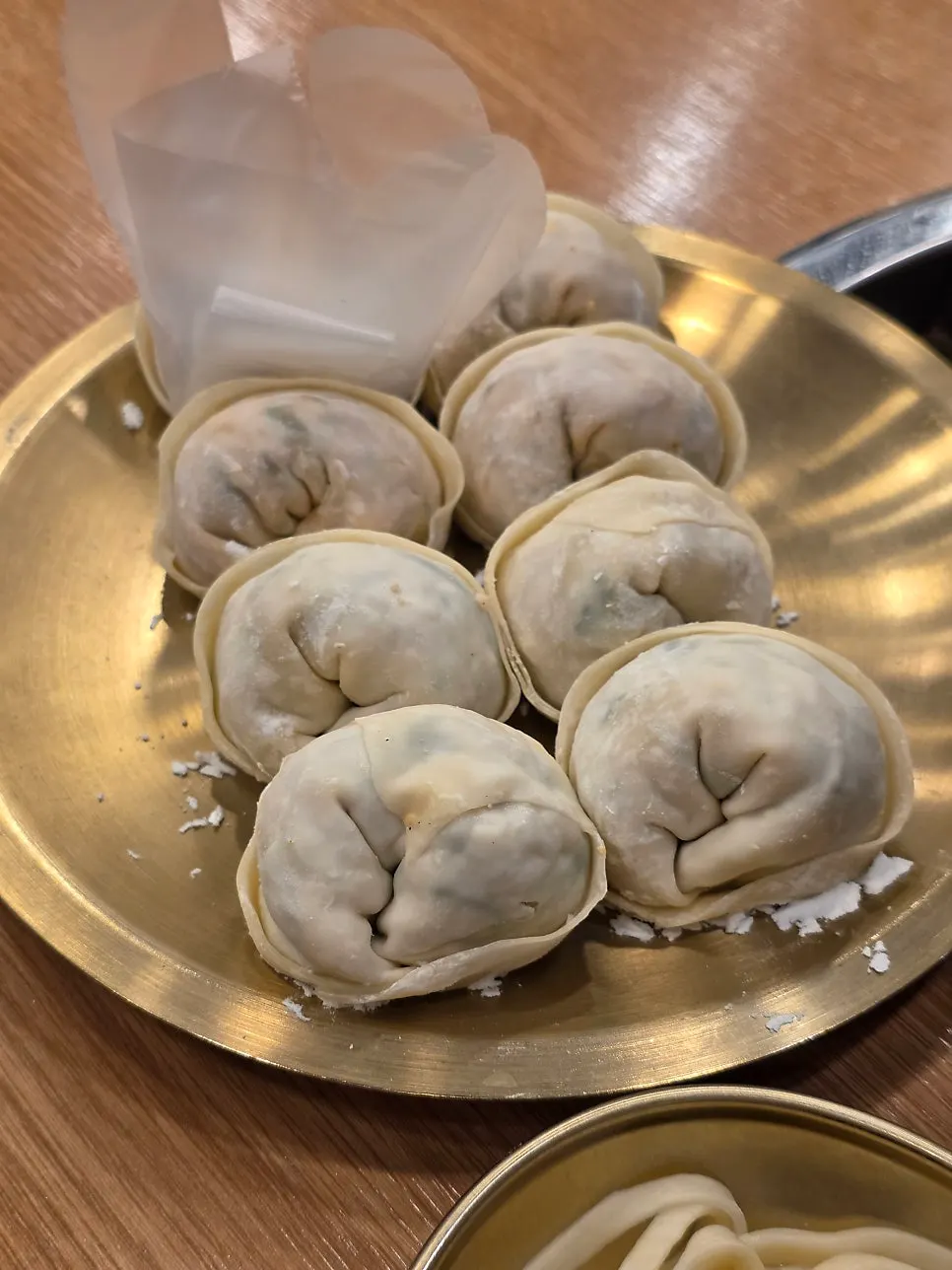 Plate of 8 kimchi and meat mandu