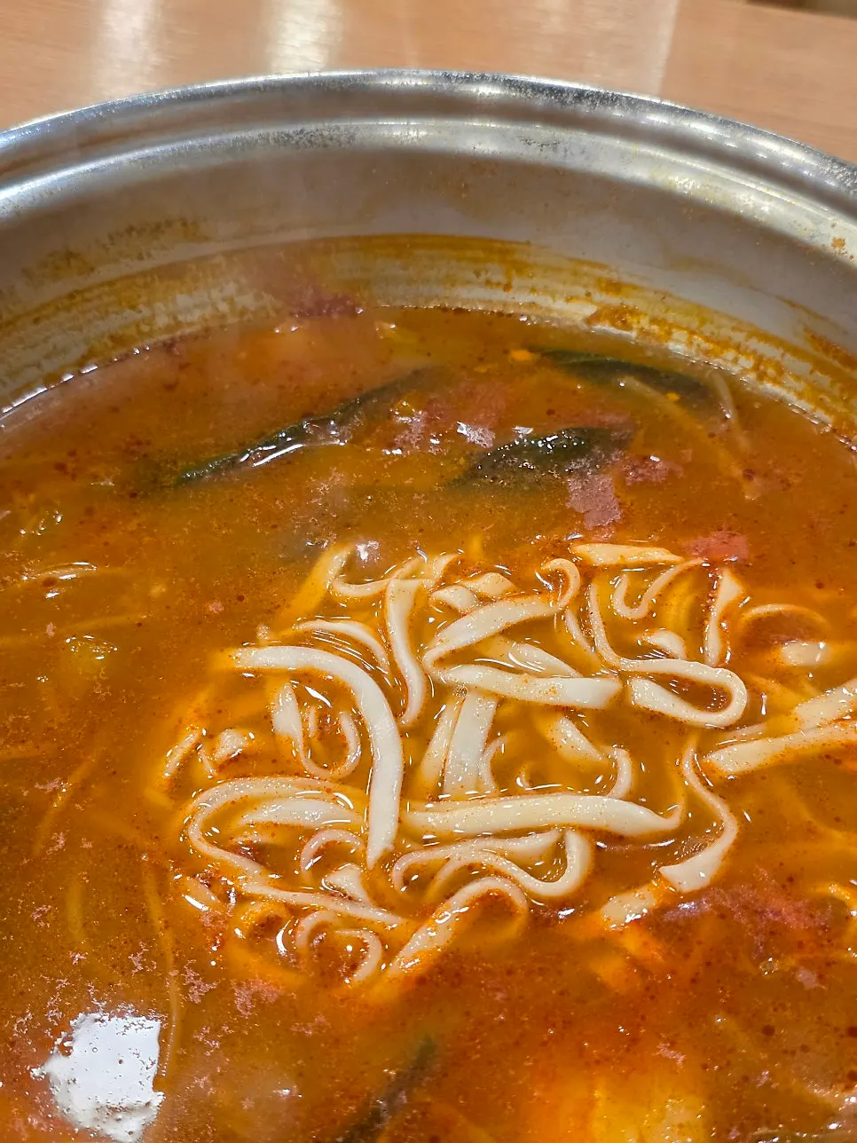 Kalguksu noodles added into the hot pot broth
