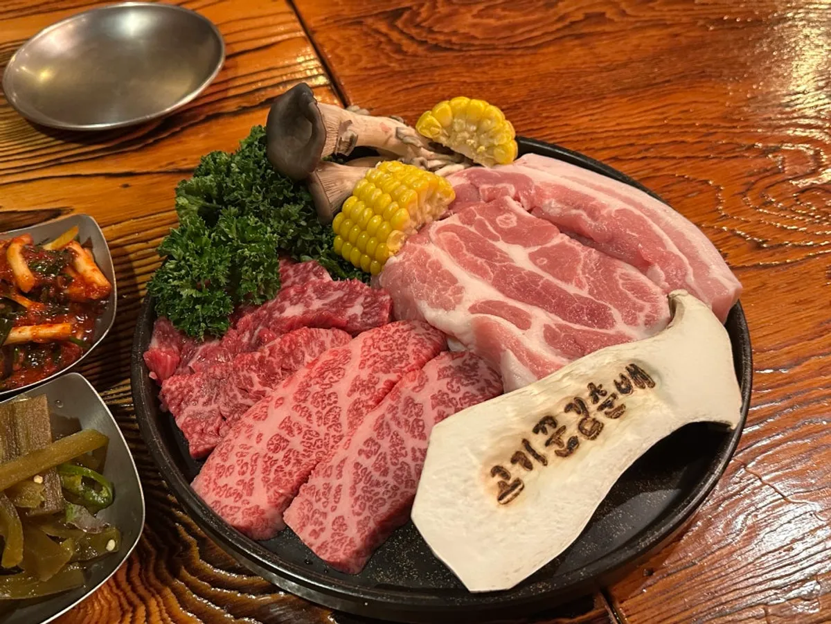 Full spread of the recommended set with hanwoo, pork neck, and pork belly