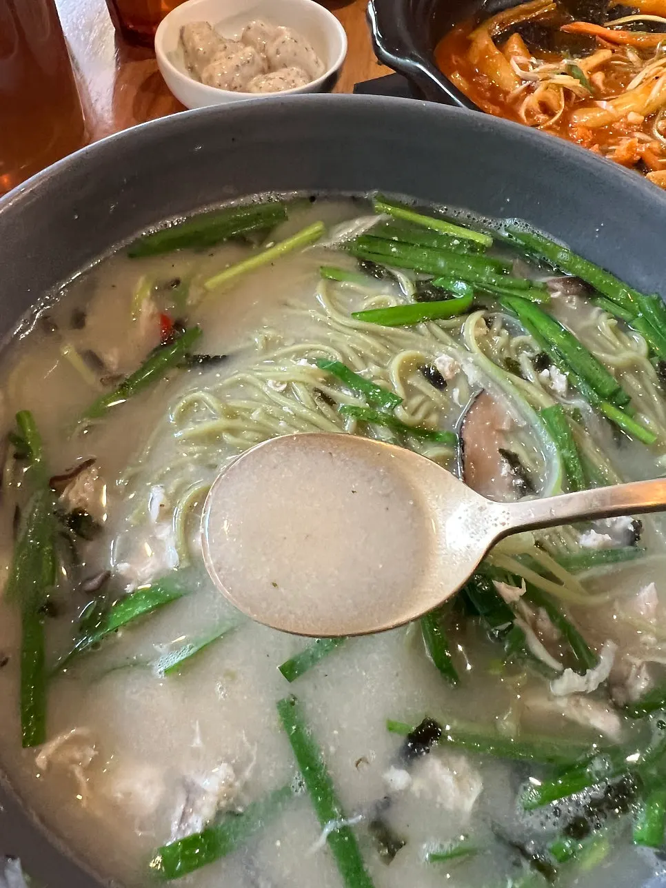 Chicken noodle soup broth and noodles with perilla powder