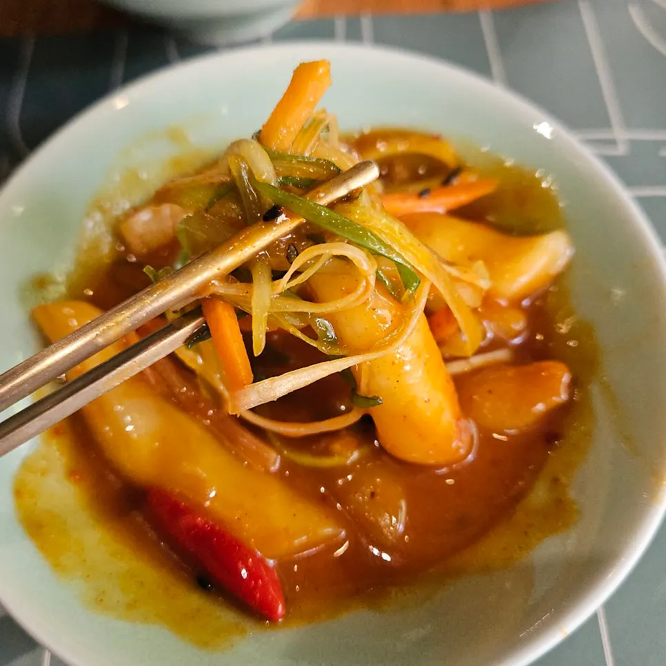 Mini tteokbokki with sauce well soaked into the rice cakes