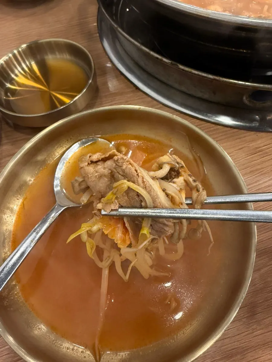 Handmade dumplings added to boiling broth