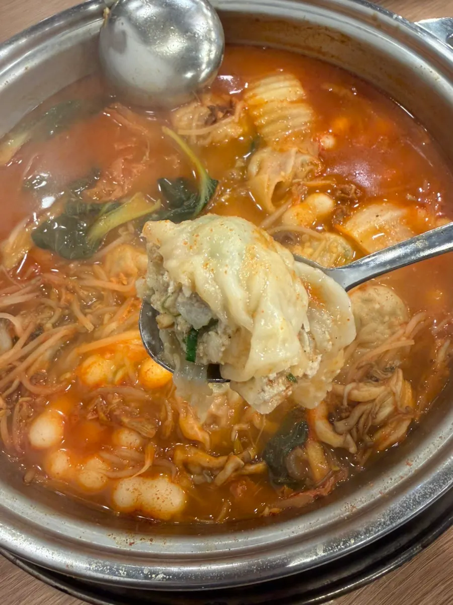 Handmade dumpling hot pot with spicy broth