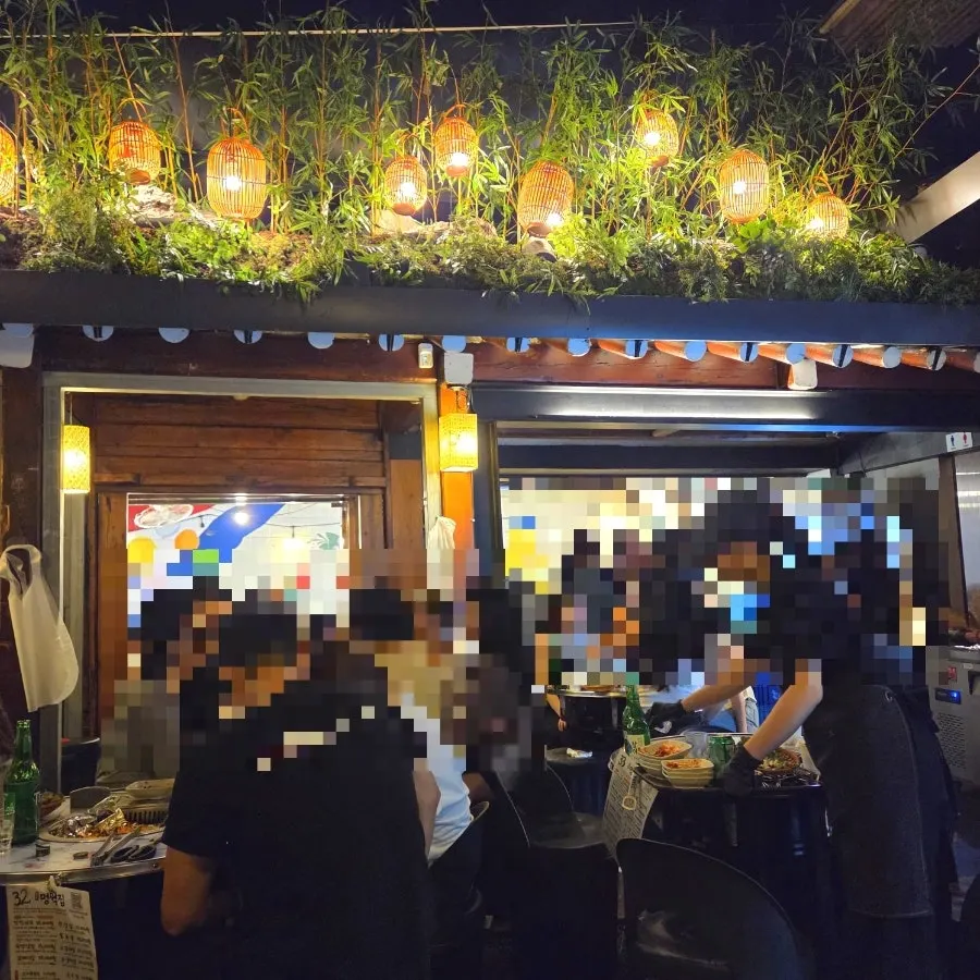 Korean BBQ restaurant atmosphere in an Ikseon-dong alley